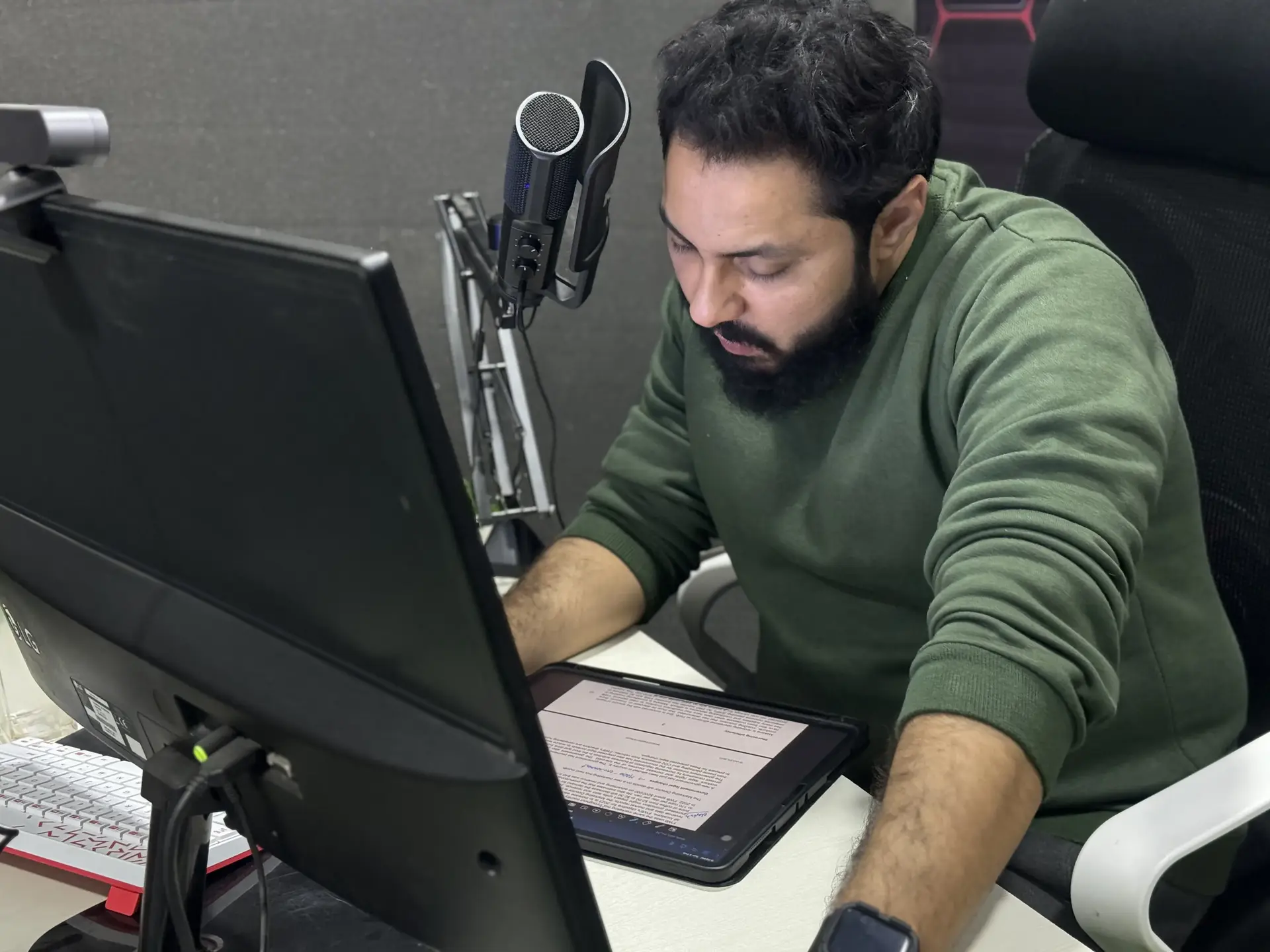 Hero background, image of Sir Saeed Surti on desk with navy blue overlay